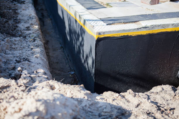 Professional Waterproofing technician working in Hilbert, WI